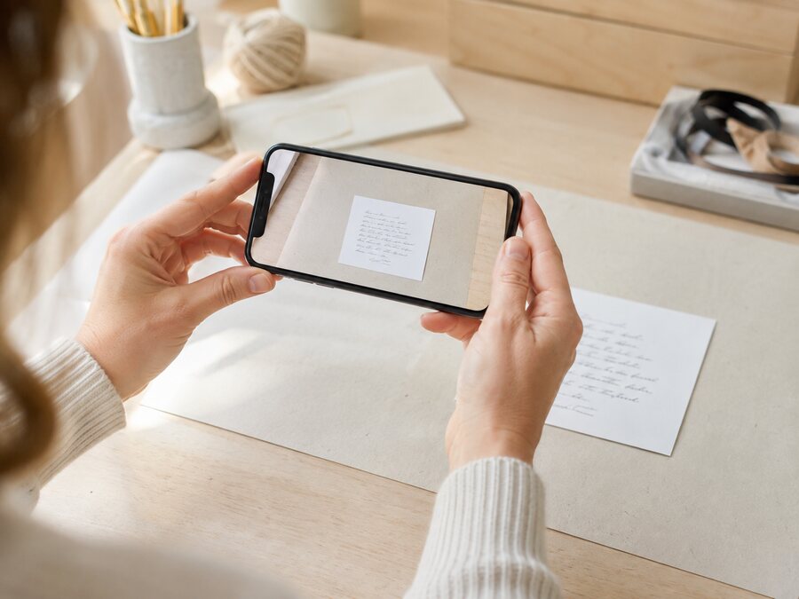 A phone photographing a handwritten note